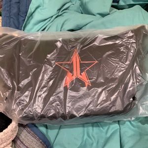 Makeup and a shirt that was in the mystery box and a purse